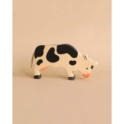 Holztiger Grazing Black Cow