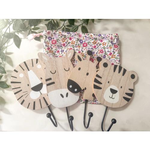 Set of 4 nursery safari hooks with handmade drawstring bag of various fabric choices. Hooks include zebra, tiger, lion and giraffe.