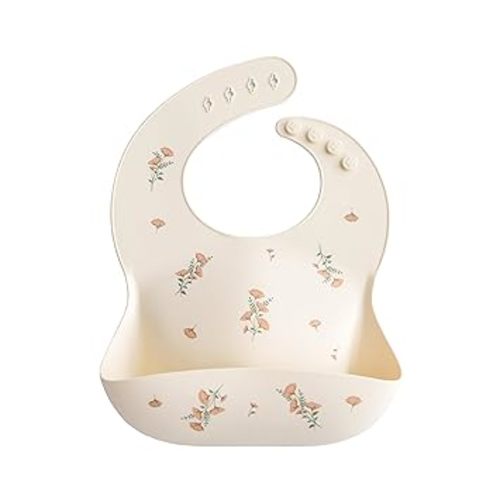 mushie Silicone Baby Bib | Adjustable Fit Waterproof Bibs (Pink Flowers) | Ages 4-24 months, Machine washable, Adjustable neck strap, Deep front pocket