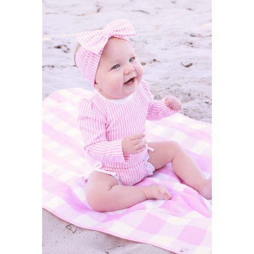Long Sleeve Rash Guard with Ruffle Bottom in Seersucker Dusty Pink | Caden Lane