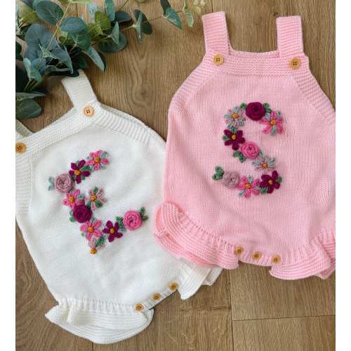 Personalised knitted cream or pink summer romper with pink floral initial. Custom summer baby outfit / photo shoot outfit