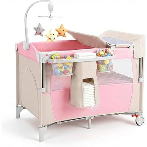 BABY JOY 5-in-1 Pink Pack and Play, Portable Baby Bedside Sleeper with Bassinet, U-Shaped Diaper Changer, Safety Strap, Side Zipper Entrance, Hangings, Bedside Crib Playard from Newborn to Toddlers