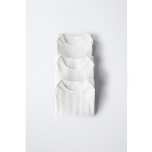 THREE-PACK OF RIBBED SLEEVELESS BODYSUITS - Oyster-white | ZARA United States