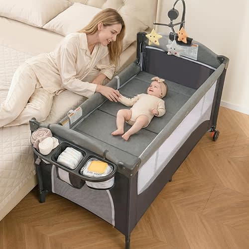 INFANS Pack and Play, 5 in 1 Baby Bedside Sleeper with Bassinet, Diaper Changer, Mattress, Carry Bag, Music Box Hanging Toys, Foldable Bedside Crib, Portable Playard for Newborn Toddlers (Classic)