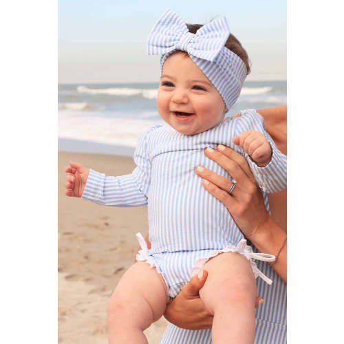 Long Sleeve Rash Guard With Ruffle Bottom in Seersucker Blue | Caden Lane