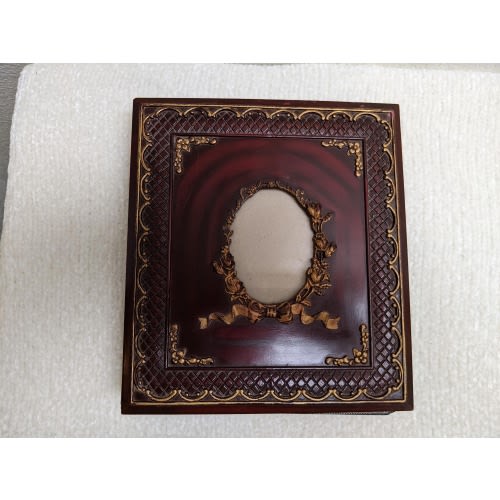 Vintage Photo Album Featuring an Embossed Cover Design