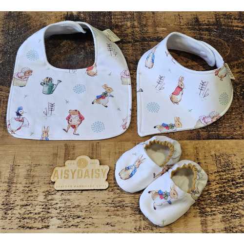 Baby Bib or Dribble bib in Peter Rabbit themed fabric. Matching shoes also available, Sizes 0-3m up to 12-18m