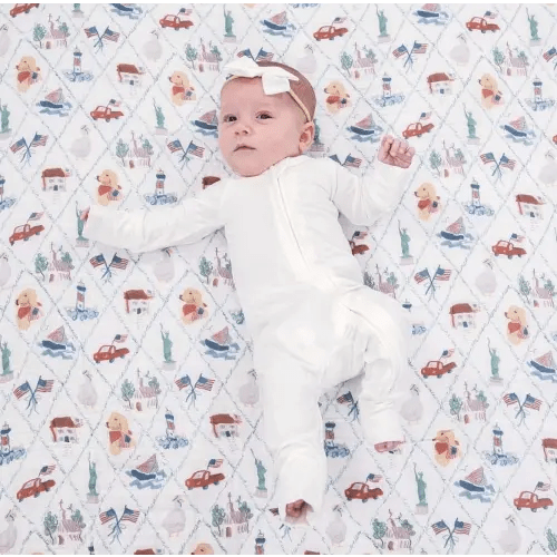 100% organic cotton infant baby swaddle with hand-drawn Americana motifs, flag, and patriotic style — The Littlest Statesmen | An American Children's Company Celebrating America's 250th with a Curated Collection of Hand-Painted Books, Patriotic Apparel, a