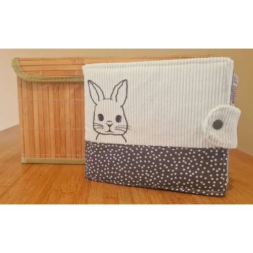 Handmade baby photo album in white corduroy with a rabbit theme, ready to be personalized.