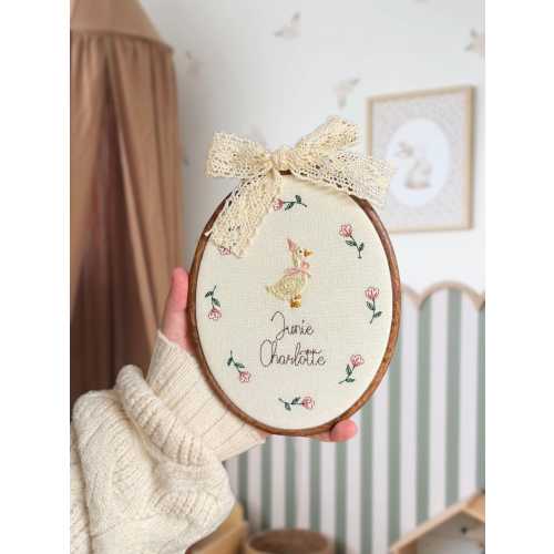 Baby name sign embroidered with storybook goose and florals, newborn birth announcement plaque, oval nursery wall hanging, gift for new mum
