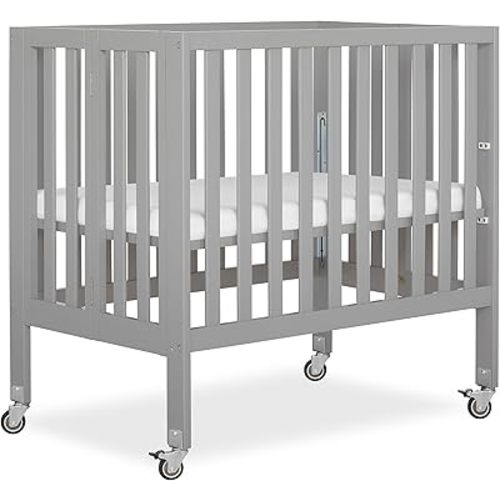 Dream On Me Jett Mini Folding Baby Crib in Pebble Grey, GreenGuard Gold & BSA, Lightweight & Portable, Patented Flat Folding System, Small Spaces & Travel, 1.5” Mattress Pad, 3 Heights, Safe Wheels