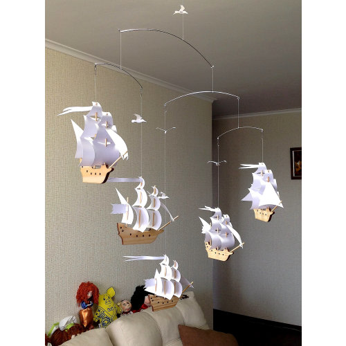 Five beautiful wooden sailboats with snow-white sails. Beautiful decor for any room in the house. Children's mobile.