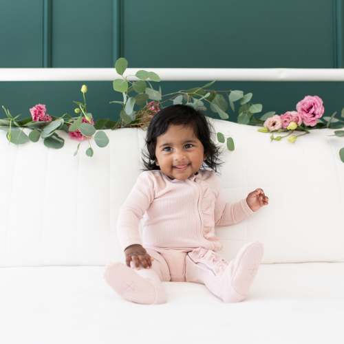 Ribbed Ruffle Bamboo Zipper Footie in Blush | Kyte Baby