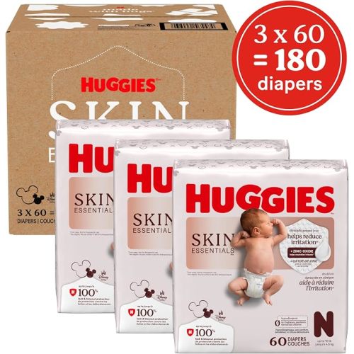 Huggies Size Newborn Diapers, Skin Essentials Baby Diapers, Size Newborn (6-9 lbs), 180 Count (3 Packs of 60), Packaging May Vary
