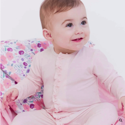 Pink polka-dot magnetic me footed onesie