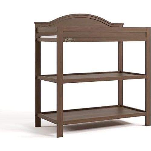 Graco Story Changing Table with Water-Resistant Pad – GREENGUARD Gold Certified Baby Changing Station with Safety Strap, 2 Open Shelves, and a Nursery Must-Have Design (Hazelnut)