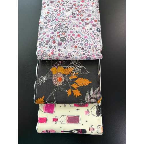 Burp cloths, potions, skulls, bones, spider webs, witches, flowers, baby shower