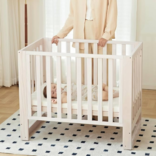 MAMAZING EvoNest Baby Crib, 6 in 1 Convertible Mini Crib with Wheels, 100% New Zealand Wood Growing Bed, 4 Adjustable Mattress Height, GREENGUARD Gold Certified, Washed Natural