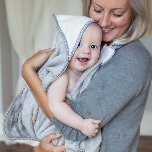 Award winning Cuddledry apron style hooded baby towel makes bathing new baby safe and easy - recommended for newborn - perfect baby gift