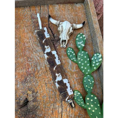 Brown and white cowprint pacifier clip