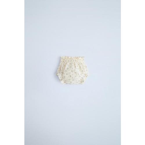 RUFFLED HEMSTITCH BODYSUITFLORAL TEXTURED BOTTOMSFLORAL COTTON TOILETRY BAG