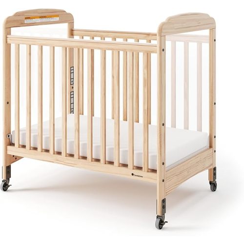 Foundations Serenity SafeReach Slatted Crib with Adjustable Mattress Board, Compact Wooden Baby Crib with Commercial Grade Casters, Includes 3” Foam Mattress (Natural)