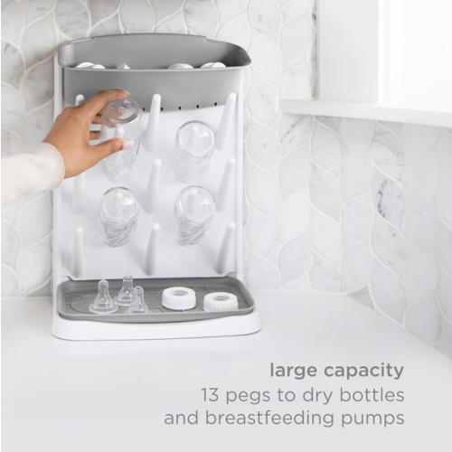 Amazon.com: Ubbi Vertical Baby Bottle Drying Rack, Space Saving Countertop Bottle Dryer | 13-Peg Bottle Drying Rack Removable Drain Tray, Baby Organizer for Pump Parts, Pacifiers & Accessories, Dishwasher Safe, Gray