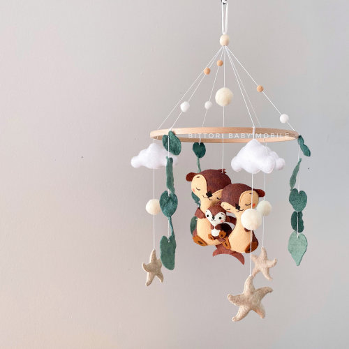 Sea otter nursery mobile with sea star. Ocean nursery decor with cute otter family. Gender neutral baby gift. Nautical baby shower gift.