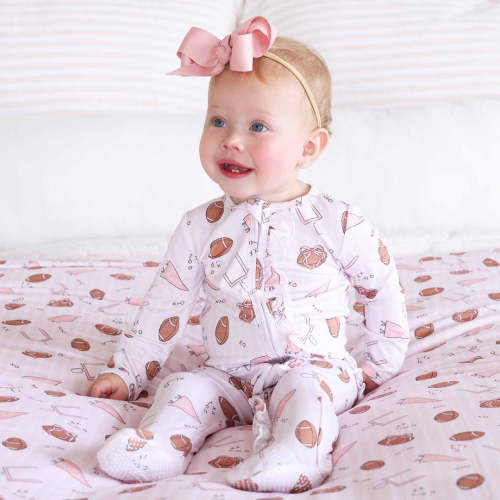 Tiny Touchdowns Ruffle Zipper Footie in Pink | Caden Lane
