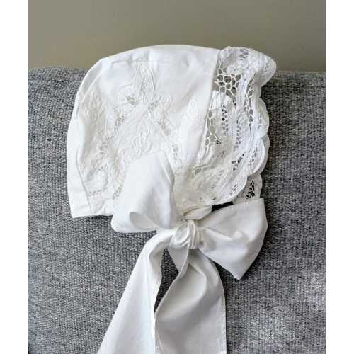 White embroidered cotton baby bonnet