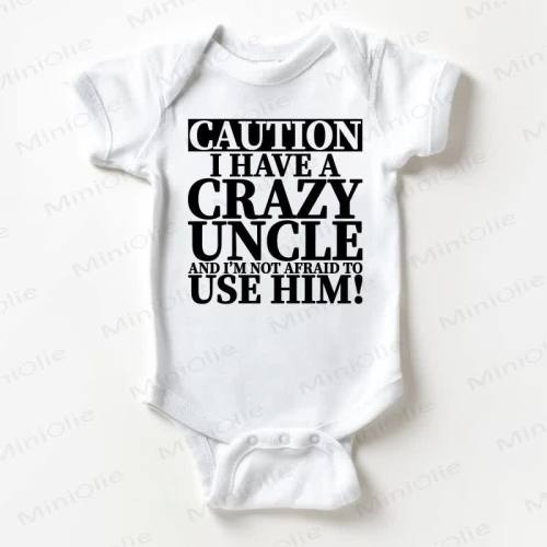 CAUTION I HAVE A CRAZY UNCLE AND I'M NOT AFRAID TO USE HIM Baby White Bodysuit