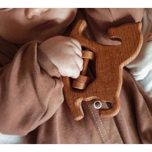 The first rattle for the newborn from natural materials