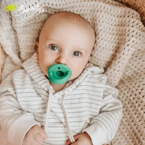 Itzy Ritzy Silicone Pacifiers for Newborn - Itzy Soother Pacifiers Feature Collapsible Handle & Two Air Holes for Added Safety; For Ages Newborn and Up, Set of 2 in Hero Blue & Clover