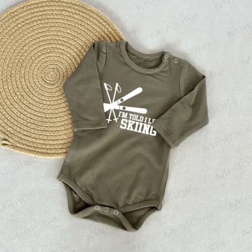 IM TOLD I LIKE SKIING Baby Green Bodysuit