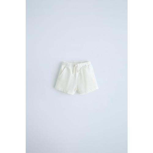 BUTTON TANK TOPDRAWSTRING SHORTSTWO-PACK OF WAFFLE KNIT LEGGINGS