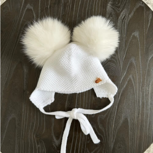 Knitted Double pompom hat .