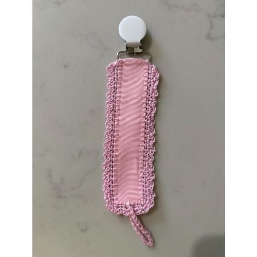 Pink pacifier clip is made of pink ribbon and pink hand crochet trim with clip.