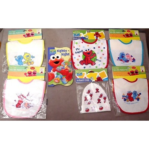SESAME STREET BOARD BOOK PLUS 5 ASSORTED BIBS & ONE INFANT CAP LOT OF 7 ITEMS