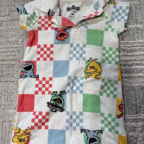 Sesame Street baby romper with checkered pattern and...