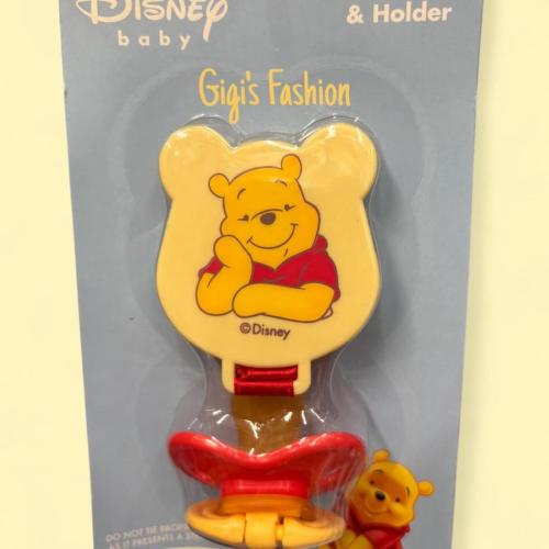 Disney Winnie the Pooh pacifier and holder...