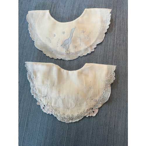 Pair of vintage baby bibs with embroidery detail