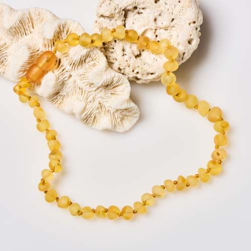 #1 Best-Selling Amber Teething Necklace for Babies & Kids - Raw Honey – Powell's Owls