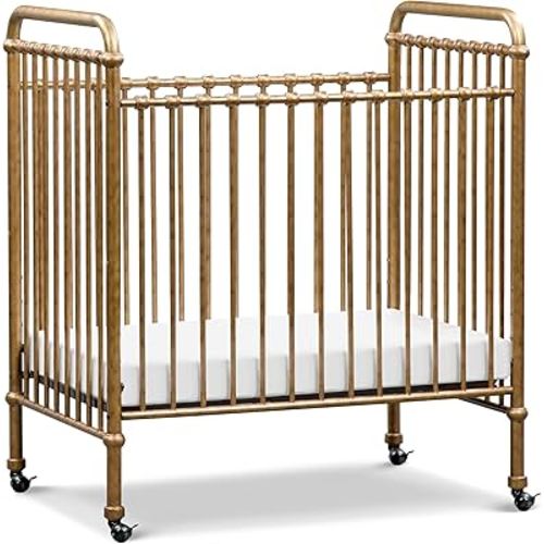 NAMESAKE Abigail 3-in-1 Portable Baby Crib with Wheels - GREENGUARD Gold Certified Convertible Crib to Toddler Bed & Daybed - Metal Baby Bed w/ 4 Adjustable Mattress Heights, for Small Spaces - Gold