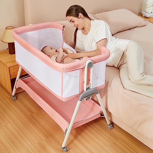 ANGELBLISS Baby Bassinet Bedside Crib with Storage Basket and Wheels, Easy Folding Bed Side Sleeper Adjustable Height Portable Crib for Newborn (Pink)