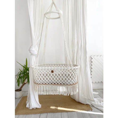 Hanging macrame baby bassinet