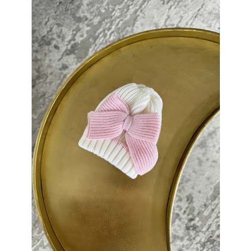 Beautiful knitted Merino wool Ivory/White Baby girl hat with Bow details.