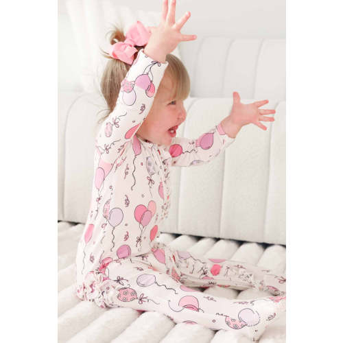 Party Time Ruffle Zipper Footie in Pink | Caden Lane
