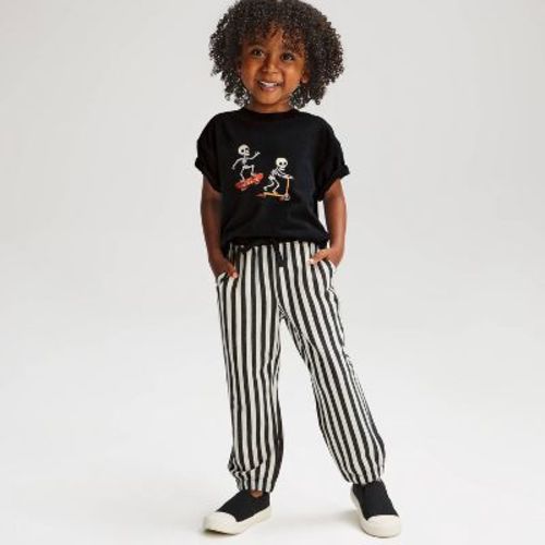 Toddler Boys' 2pc Halloween Skating Skeleton Short Sleeve French Terry Top & Bottom Set- Cat & Jack™ Black 4T