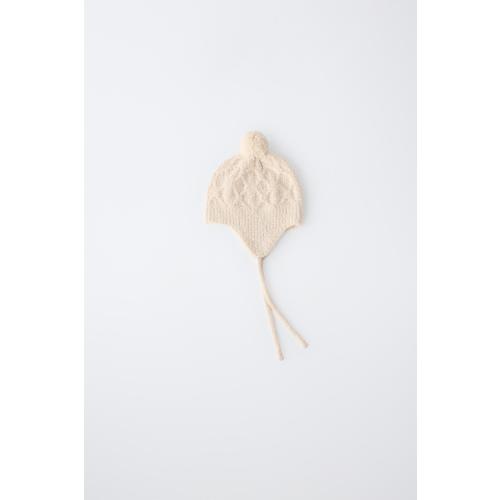 CABLE-KNIT POMPOM EARFLAP BEANIE - Ecru | ZARA United States