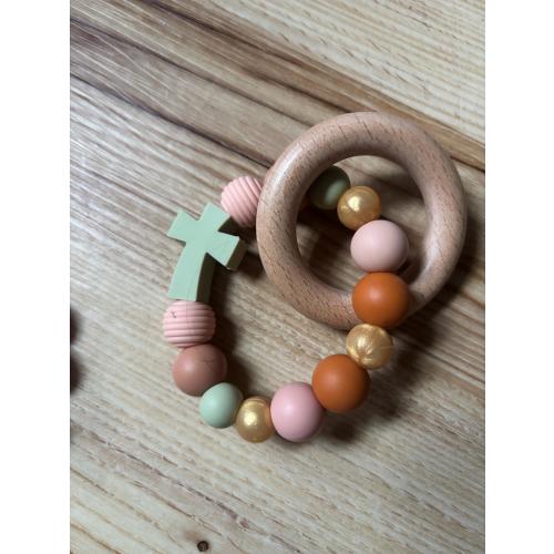 Wood cross and silicone bead grasping toy